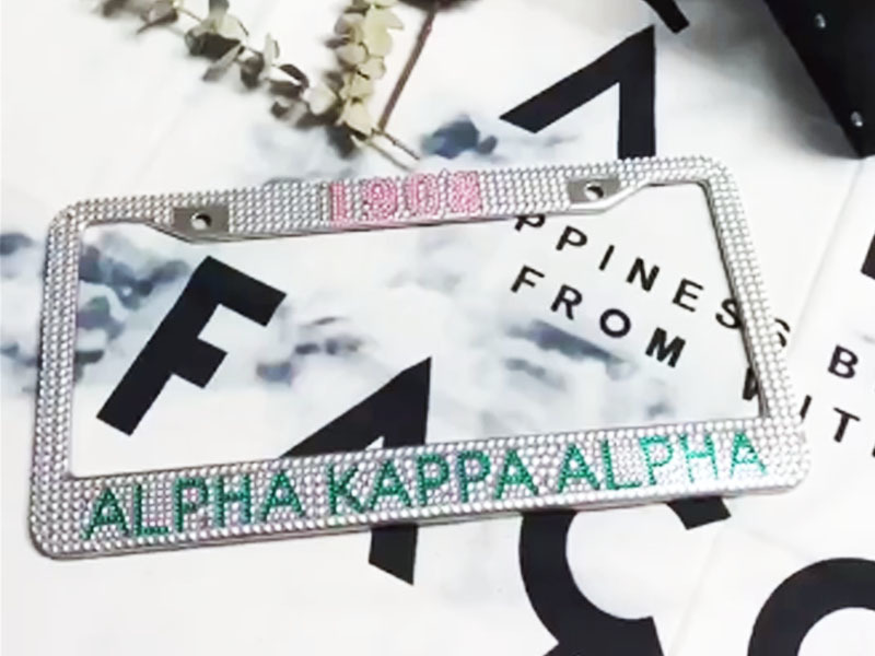 AKA pink and green rhinestone license plate frames